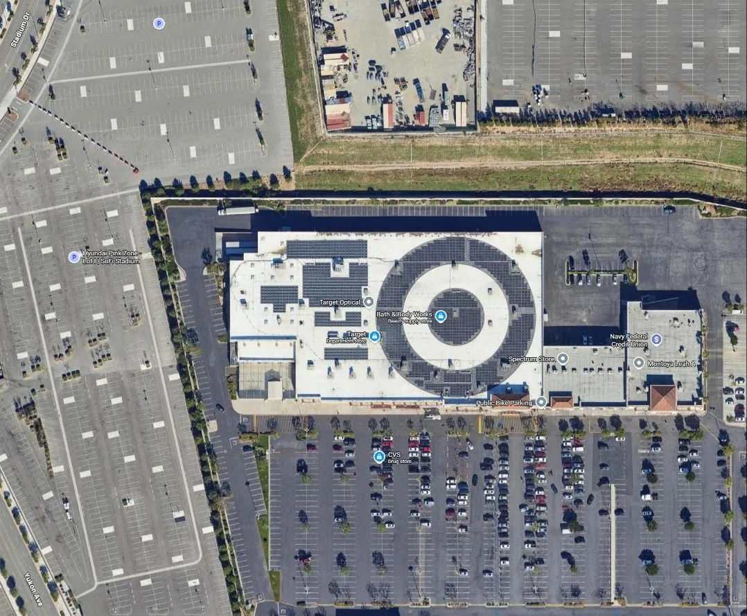 Satellite view of the circular helix-tilt rooftop solar array on a big-box retail store roof